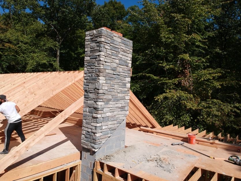 Outdoor fireplace and chimney installation with stone veneer in Wayne, Passaic County, NJ
