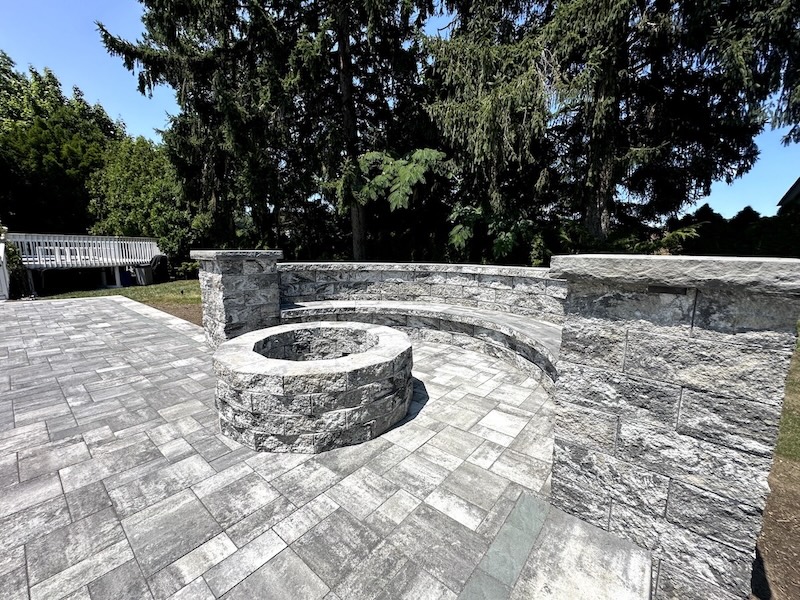 Paver patio with a fire pit and retaining wall, installed by Masonry Pro Construction at Clifton, Passaic County, New Jersey