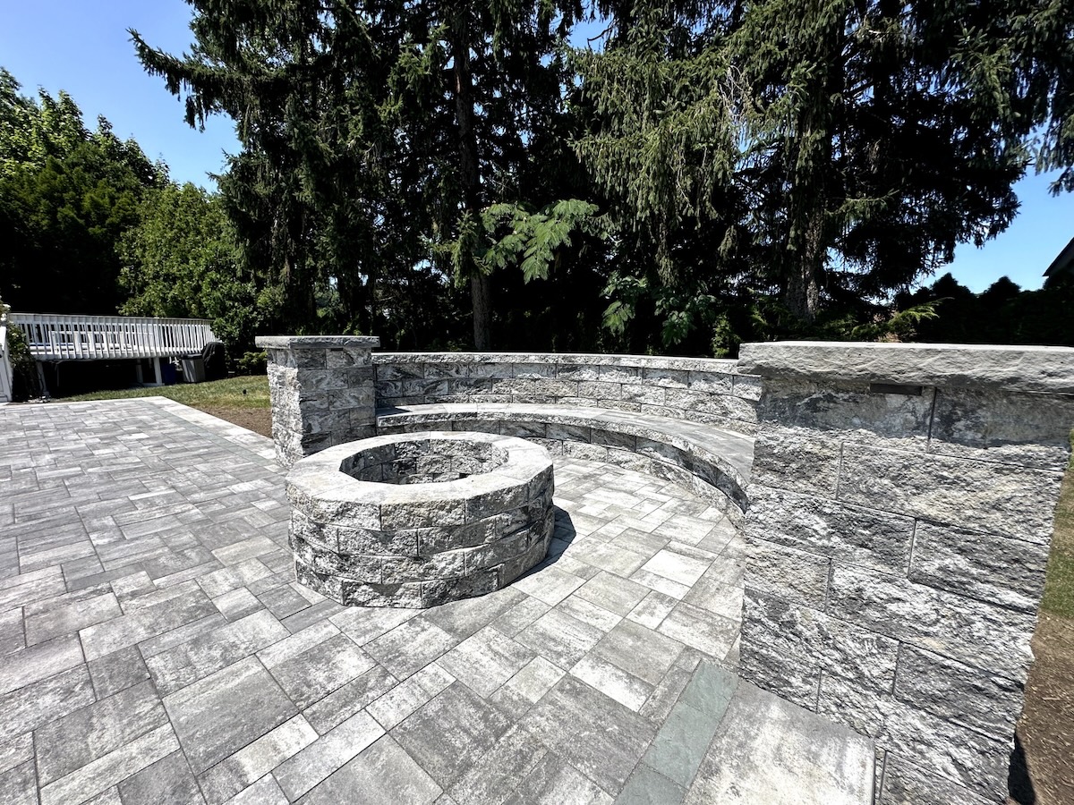 Completed masonry paver patio installation at a home in Clifton, Passaic County, NJ, by Masonry Pro Construction.