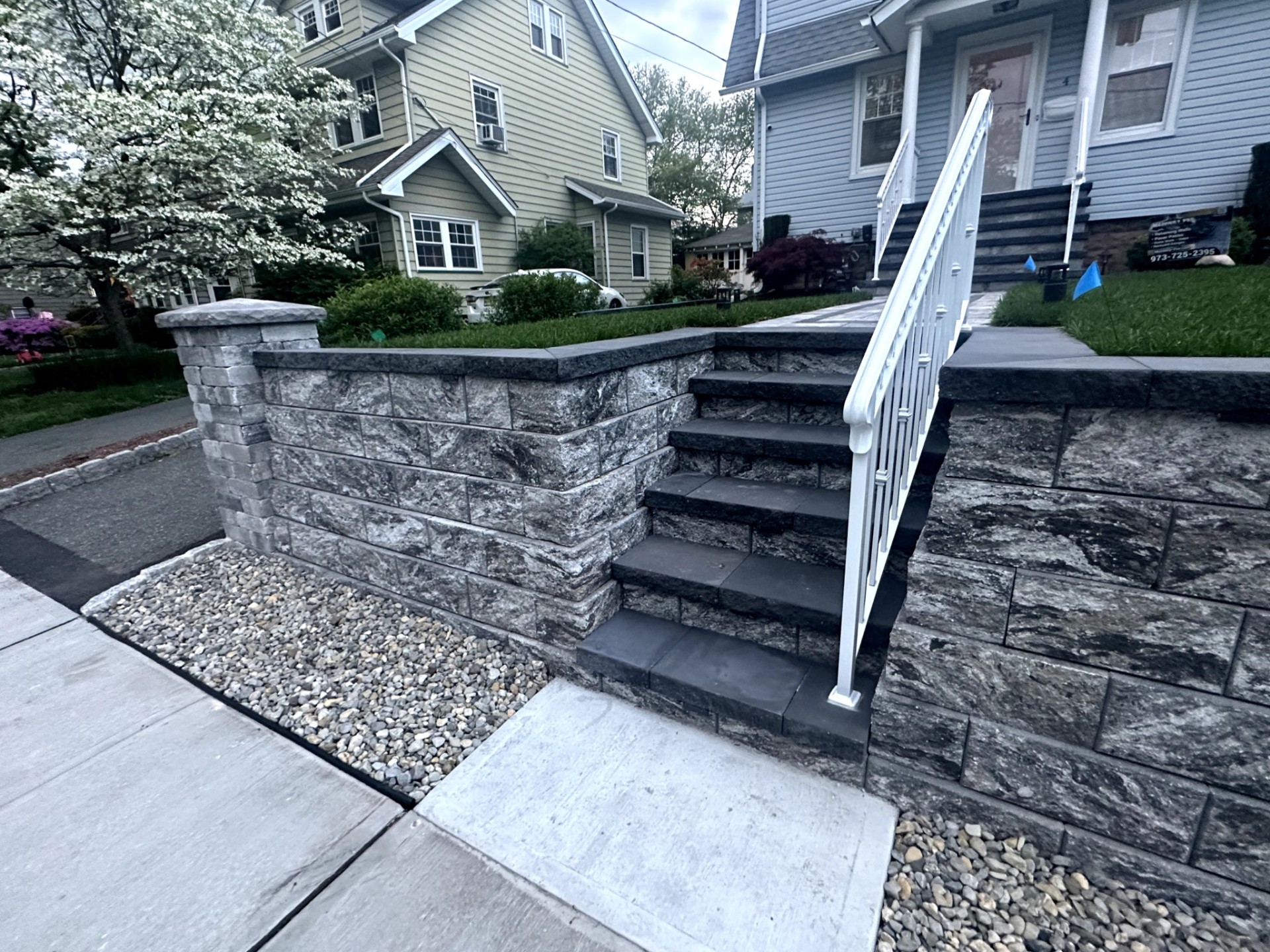 Completed masonry stairs with retaining wall at a residential property in Nutley, Essex County, NJ, by Masonry Pro Construction.