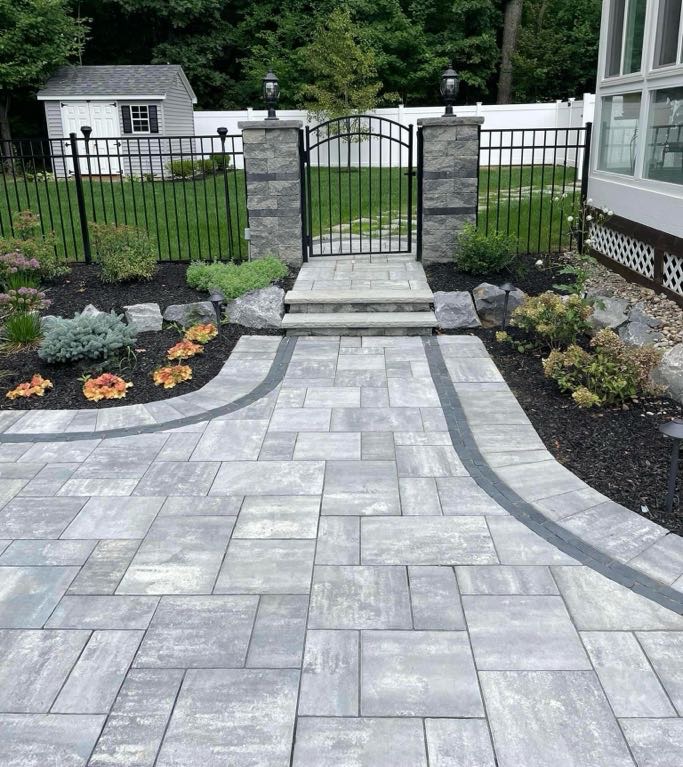 Completed masonry walkway with paver stones leading to the front entrance of a home in Bloomfield, Essex County, New Jersey.