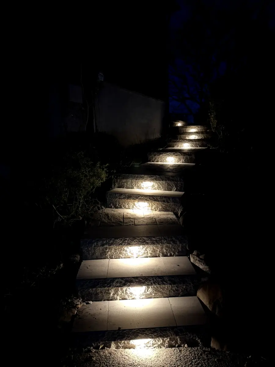 Illuminated paver steps provide a safe walkway at night in Verona, Essex County, NJ. Masonry Pro Construction