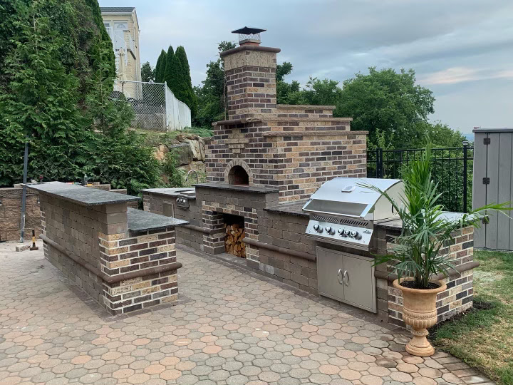 Custom brick outdoor kitchen with built-in grill and oven in Totowa, Passaic County, NJ by Masonry Pro Construction
