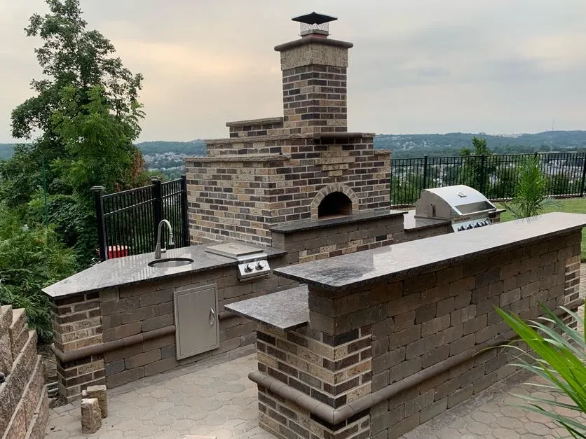Completed outdoor kitchen installation at a home in Totowa, Passaic County, NJ, by Masonry Pro Construction.