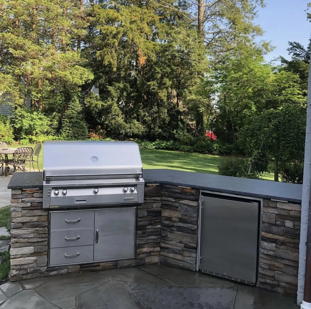 Completed outdoor kitchen with built-in grill at a property in Clifton, Passaic County, NJ, by Masonry Pro Construction.