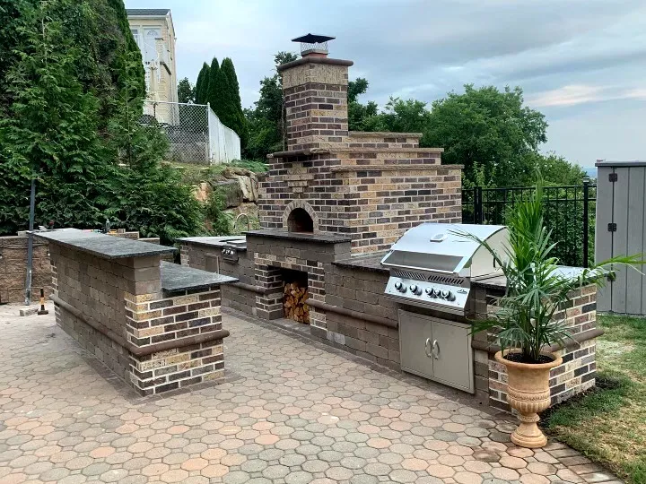 Custom brick outdoor kitchen with built-in grill and oven in Totowa, Passaic County, NJ by Masonry Pro Construction