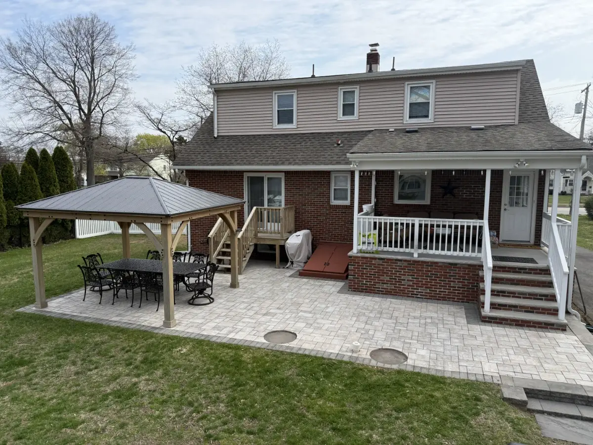 New paver patio installation with a gazebo and outdoor furniture in Pequannock Township, Morris County, NJ.