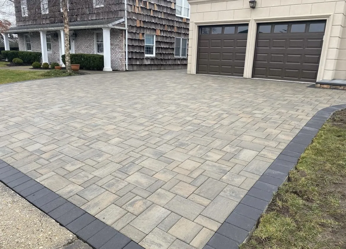Finished paver driveway at a residential home in Paramus, Bergen County, NJ, by Masonry Pro Construction.