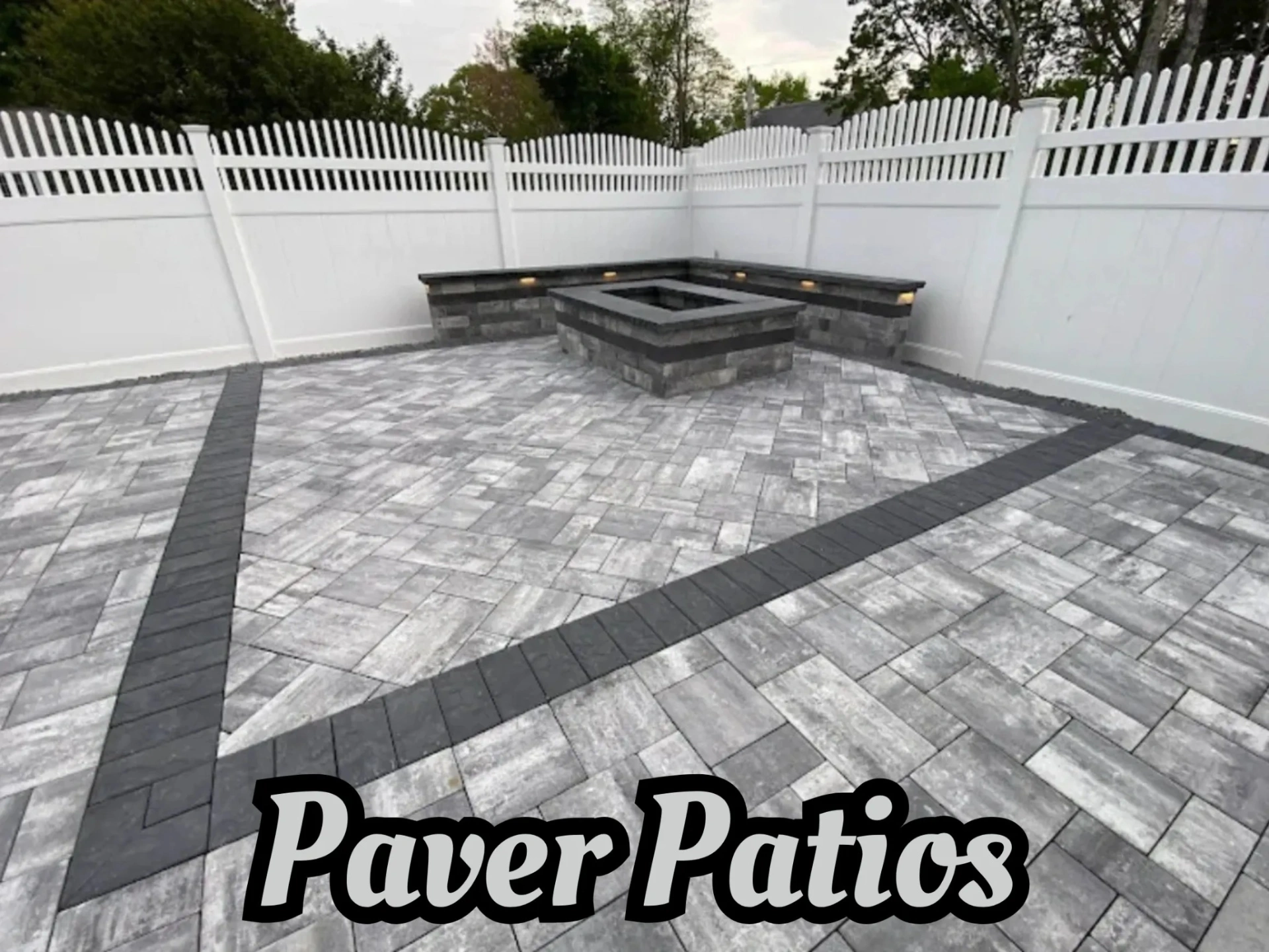 Paver patio with an integrated fire pit and seating in Bloomfield, Essex County, NJ. by Masonry Pro Construction