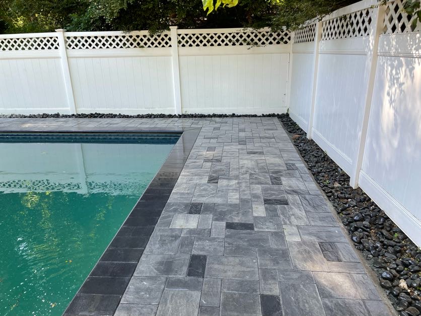 Finished paver patio installation with seating area at a residential backyard in Denville, Morris County, New Jersey.