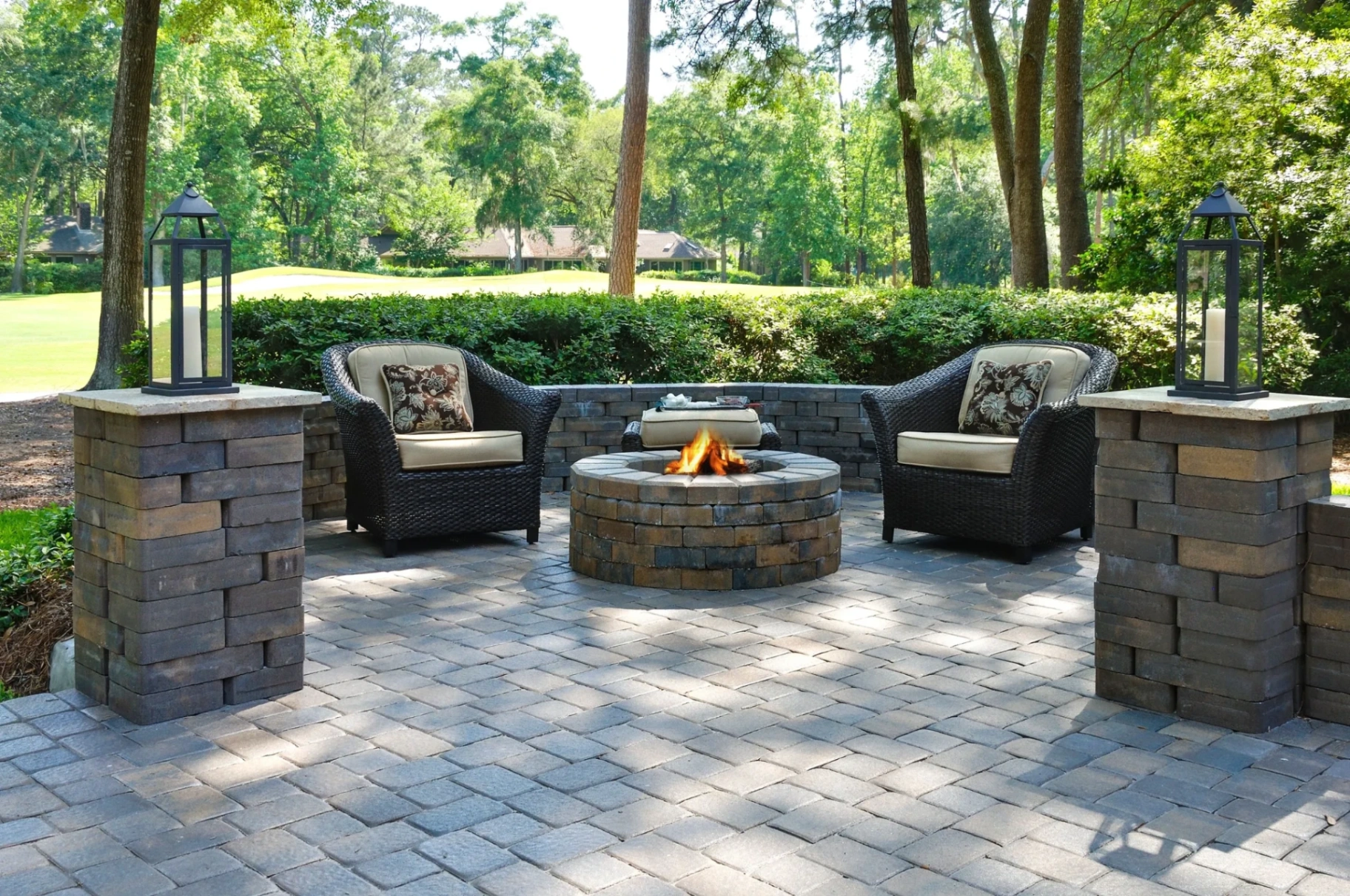 Paver patio outdoor living area with fire pit and seating in Paramus, Bergen County, NJ, by Masonry Pro Construction.