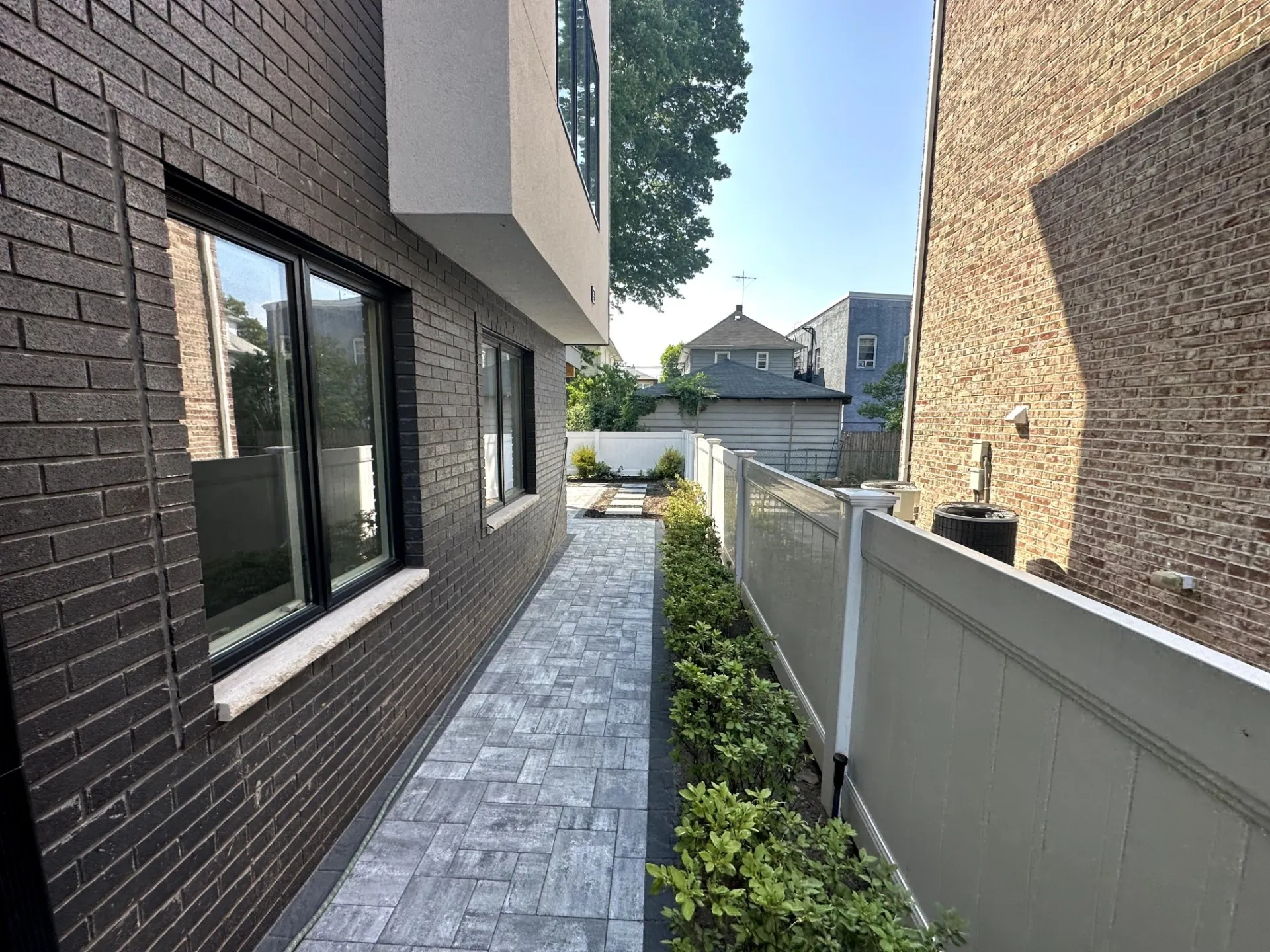 Completed paver walkway installation at a home in Palisades Park, Bergen County, NJ, by Masonry Pro Construction.