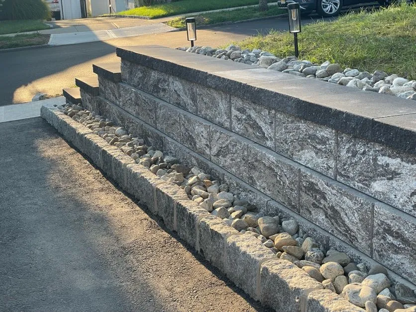 Retaining wall installation on a residential property in Bloomfield, Essex County, NJ by Masonry Pro Construction