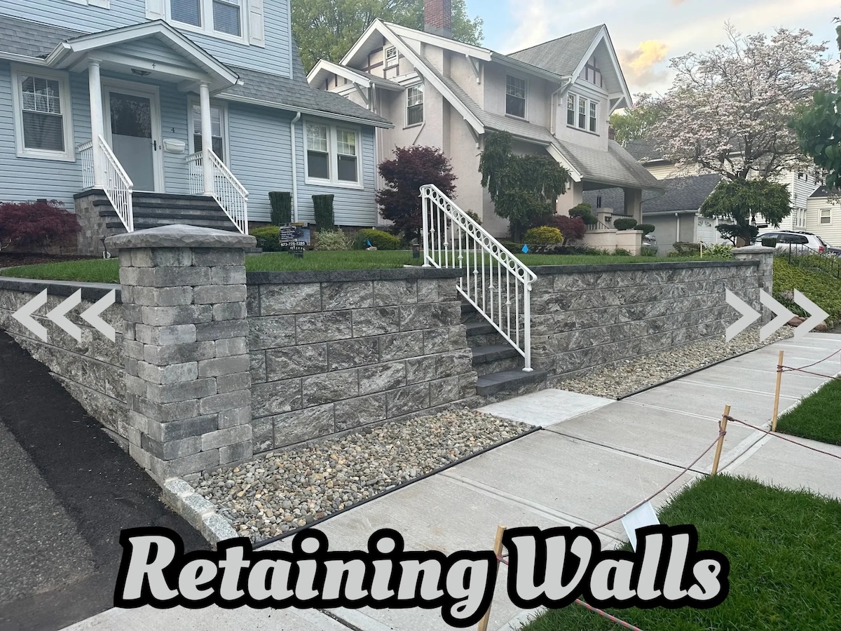 New retaining wall installation with stone steps in front of a residential home in Nutley, NJ, by Masonry Pro Construction.