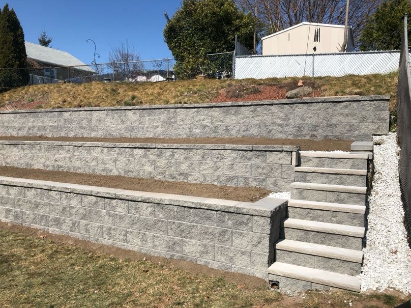 Completed retaining wall installation at a home in Wallington, Bergen County, NJ, by Masonry Pro Construction.