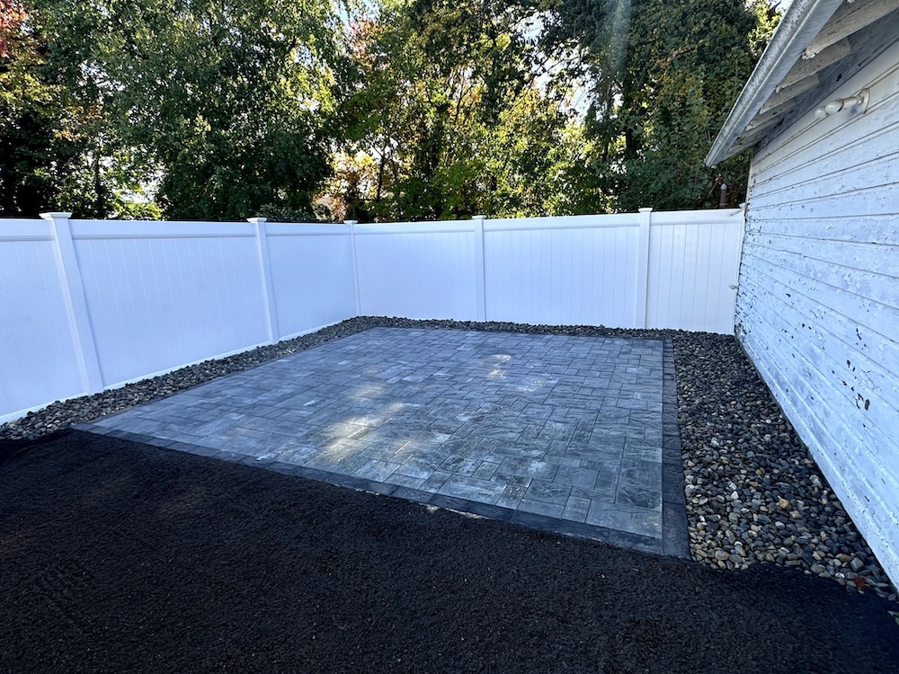 Sealing a paver patio with penetrating waterproofing product in Nutley, NJ.