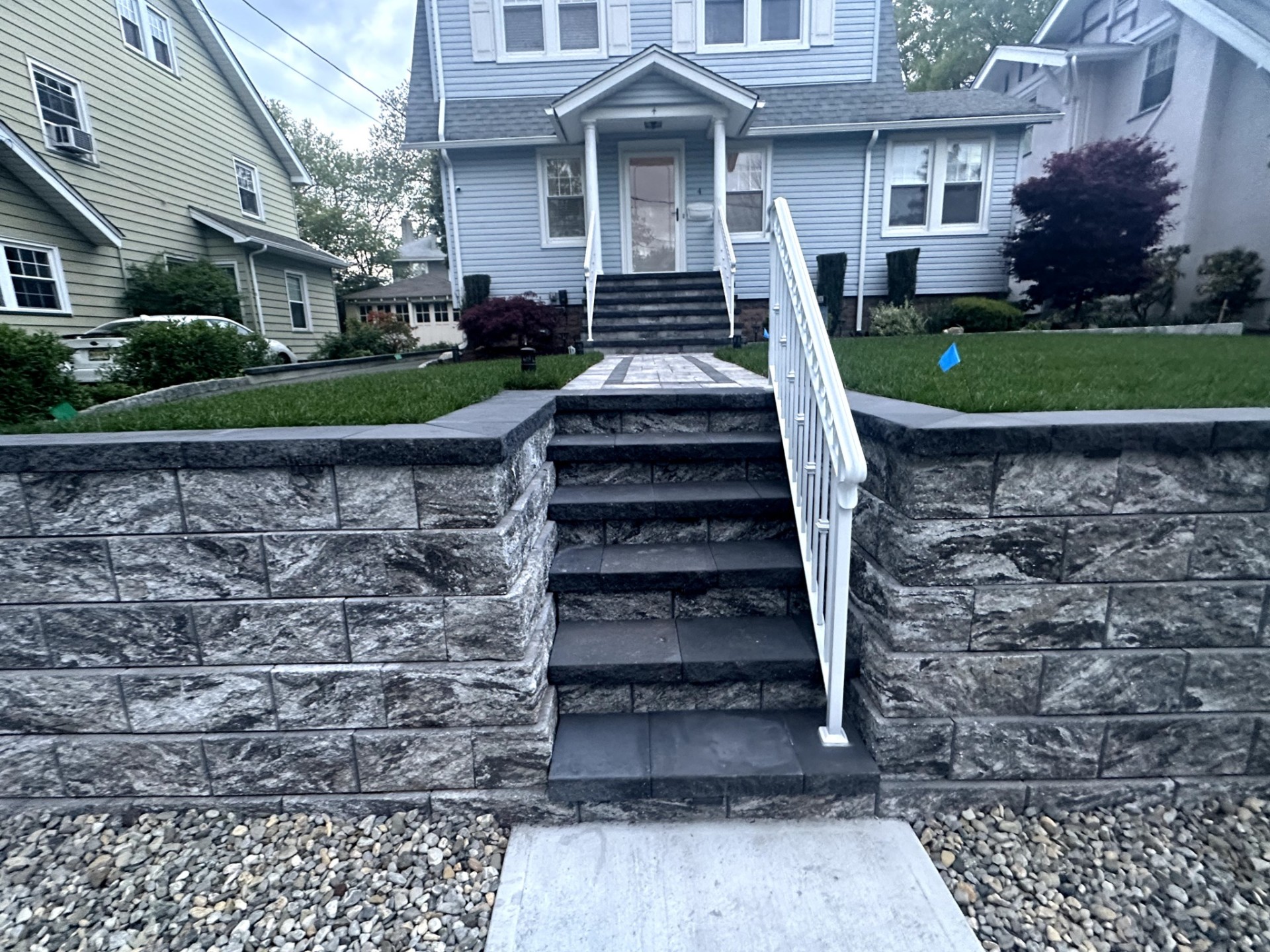 Stone masonry repair on a retaining wall and steps leading to a house in Nutley, Essex County, New Jersey