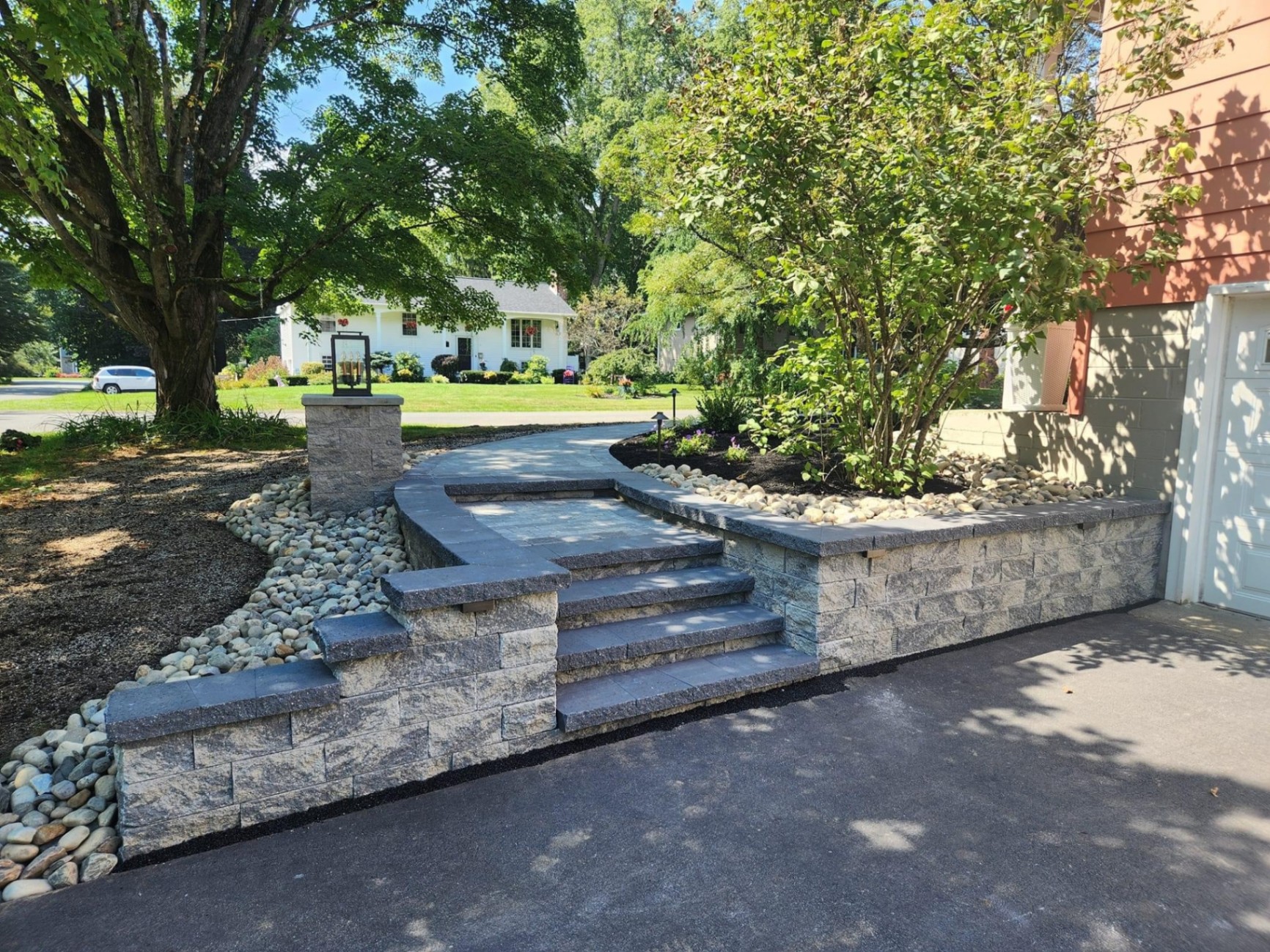 Finished natural stone masonry steps and walkway at a residential property in Montclair, Essex County, New Jersey.
