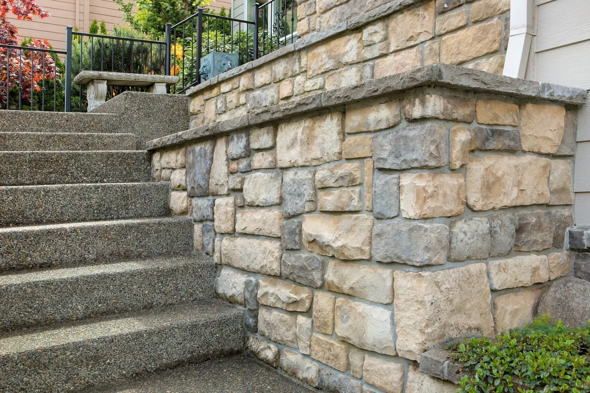 Natural stone masonry wall and steps at a residential property in Totowa, Passaic County, NJ, by Masonry Pro Construction.